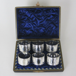 Set of Six Round Silver Plated Napkin Rings in Blue Silk Lined Box