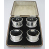 Boxed Set of Four Silver Napkin Rings in Black Velvet Lined Box