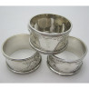 Boxed Set of Four Silver Napkin Rings in Black Velvet Lined Box