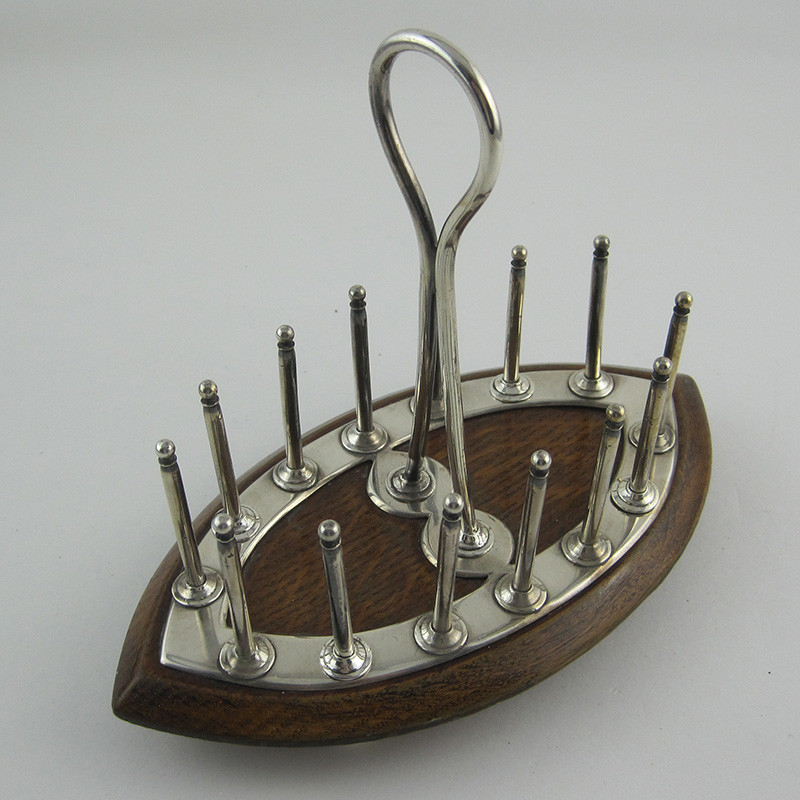 https://antiquesilverlondon.com/12345-large_default/unusual-victorian-oak-and-silver-plated-toast-rack.jpg