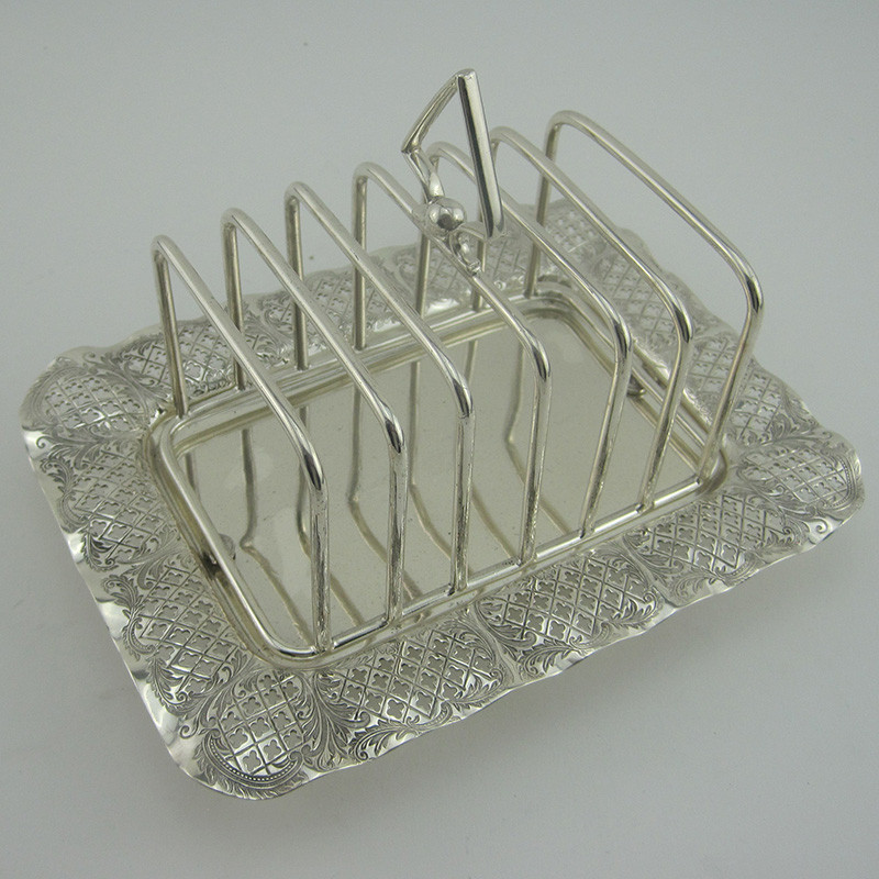 https://antiquesilverlondon.com/13118-large_default/very-pretty-late-victorian-silver-plated-toast-rack.jpg