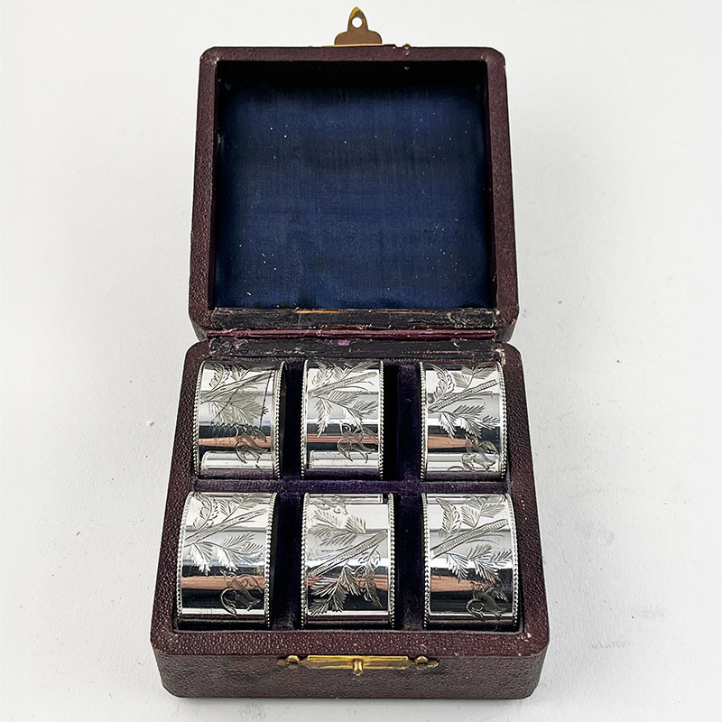 Boxed Set of Six Aesthetic Movement Engraved Silver Plated Napkin Rings (c.1895)