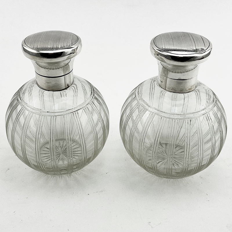 Pair of Stylish Sterling Silver and Glass Perfume Bottles (1924)
