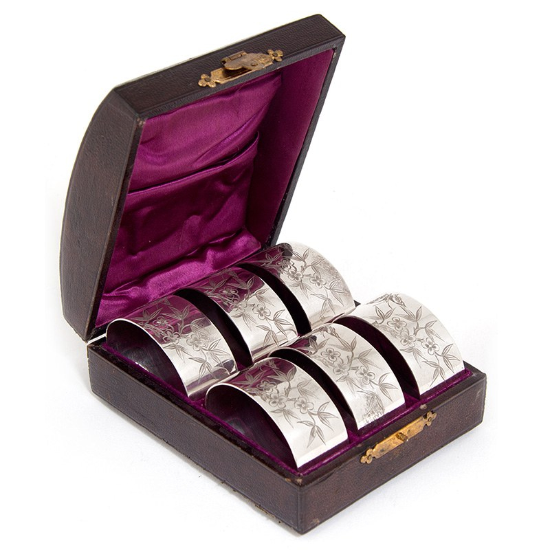 Set of Six Silver Plate Oval Napkin Rings Engraved with Butterflies, Flowers and Foliage