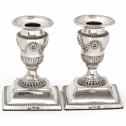 Pair of Edwardian Silver Dwarf Candlesticks with Garland and Fluted Capitals Leading to Circular Acanthus Style Collar