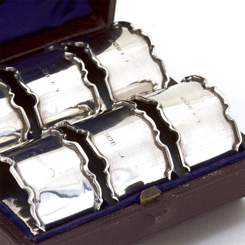 Boxed Set of Six Silver Napkin Rings with Plain Bodies and Chippendale Style Borders
