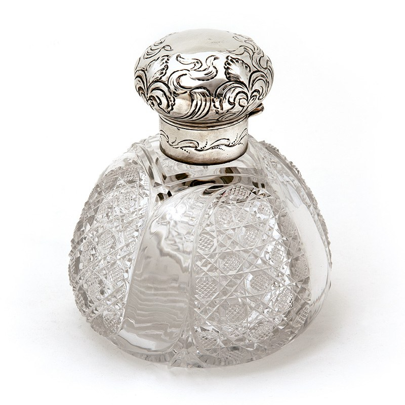 Large Late Victorian Silver Topped Perfume Bottle with a Hinged Repousse Floral Scroll Decorated Lid