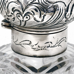 Large Late Victorian Silver Topped Perfume Bottle with a Hinged Repousse Floral Scroll Decorated Lid