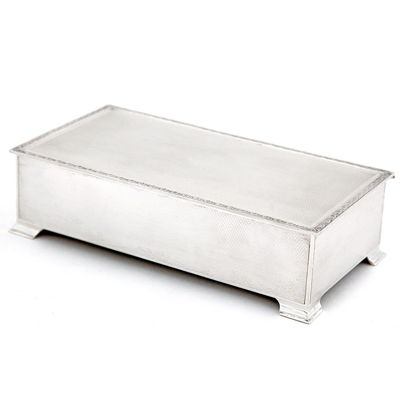 Silver Table Cigar or Cigarette Box with an Engine Turned Lid and Floral Scroll Border