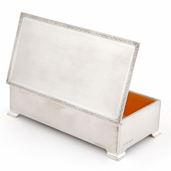 Silver Table Cigar or Cigarette Box with an Engine Turned Lid and Floral Scroll Border