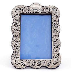 Antique Silver Photo Frame with a Pierced and Repousse Floral and Scroll Border
