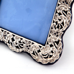 Antique Silver Photo Frame with a Pierced and Repousse Floral and Scroll Border