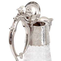 Antique Silver Plated Claret Jug with a Cast Floral Spout and Hand Engraved Glass Body
