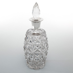 Heavy Silver Mounted Decanter with a Glass Barrel Shaped Body and Deep Star Cutting