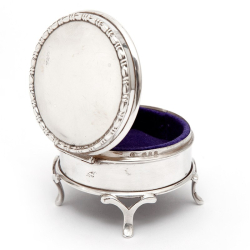 Small Circular Silver Jewellery Box with a Plain Body and Mauve Velvet Lining