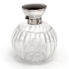 Silver Topped Perfume Bottle with a Tortoiseshell Lid and Clear Cut Glass Body