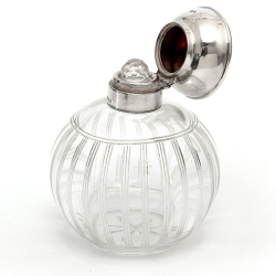 Silver Topped Perfume Bottle with a Tortoiseshell Lid and Clear Cut Glass Body