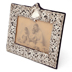 Late Victorian Silver Photo Frame Embossed and Pierced with Scrolls and Floral Scenes
