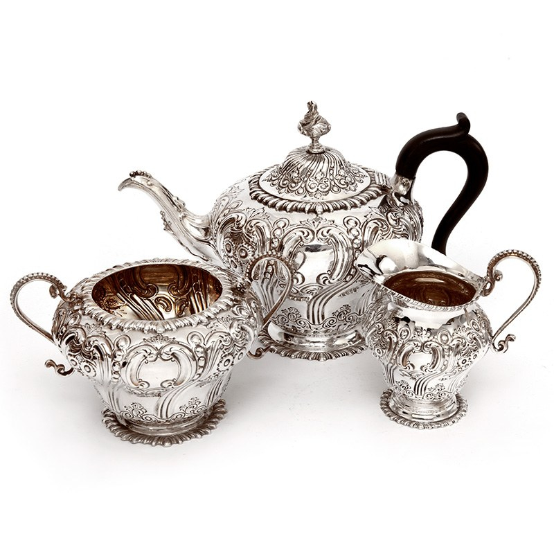 Late Victorian Three Piece Silver Tea Set Chased with Flowers and Scrolls