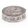 Continental Silver Pill Box with an Embossed Torch and Quiver Motif Lid