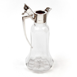 Edwardian Silver Mounted Claret Jug with an Angled Handle and Flaring Clear Glass Body