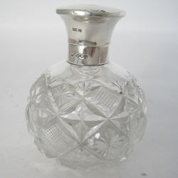 Silver Topped Perfume Bottle with a Hinged Circular Hammered Design Top