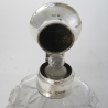 Silver Topped Perfume Bottle with a Hinged Circular Hammered Design Top